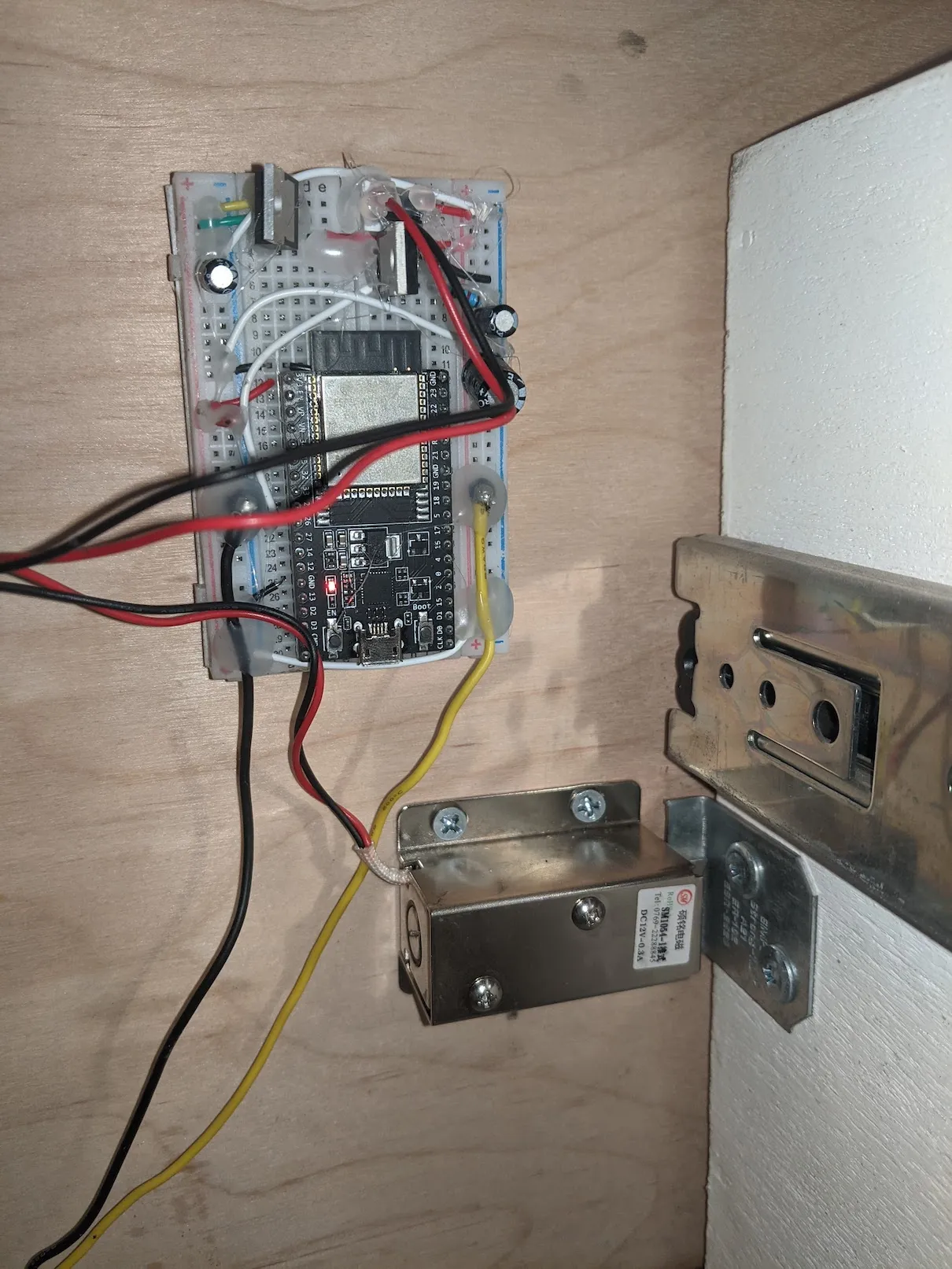 Solenoid latch mounted on a drawer