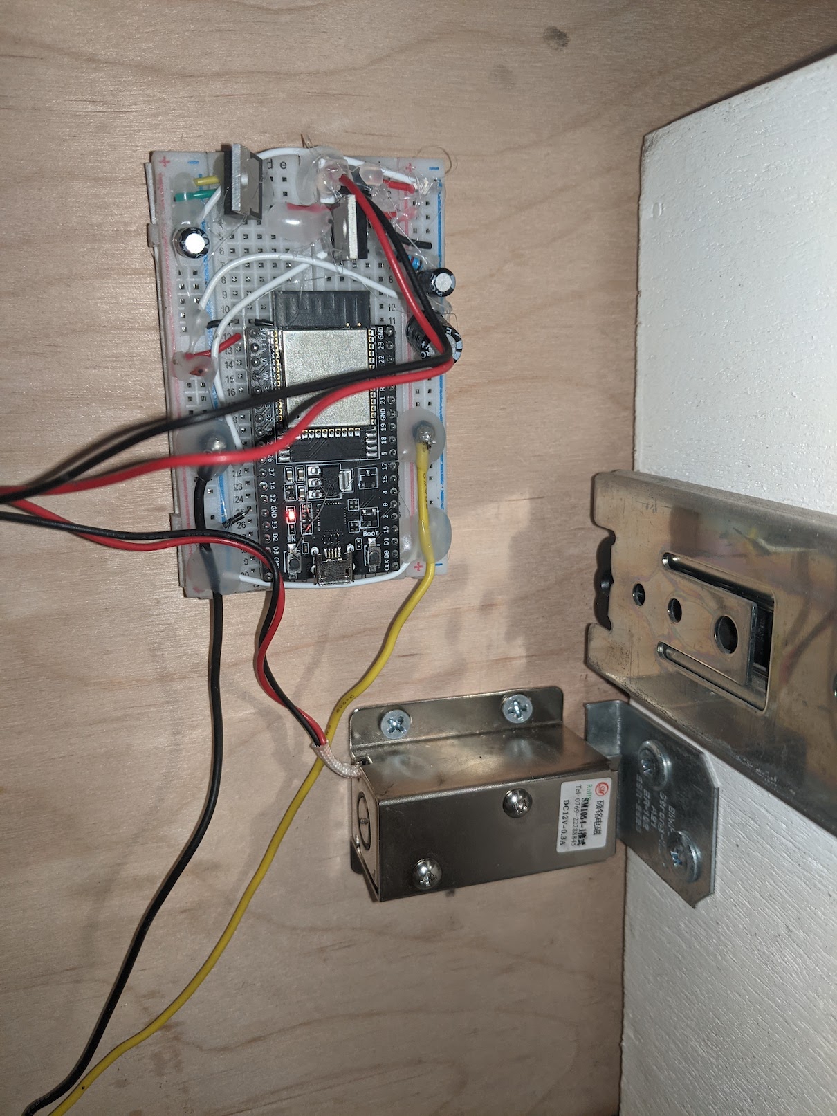 Solenoid latch mounted on a drawer